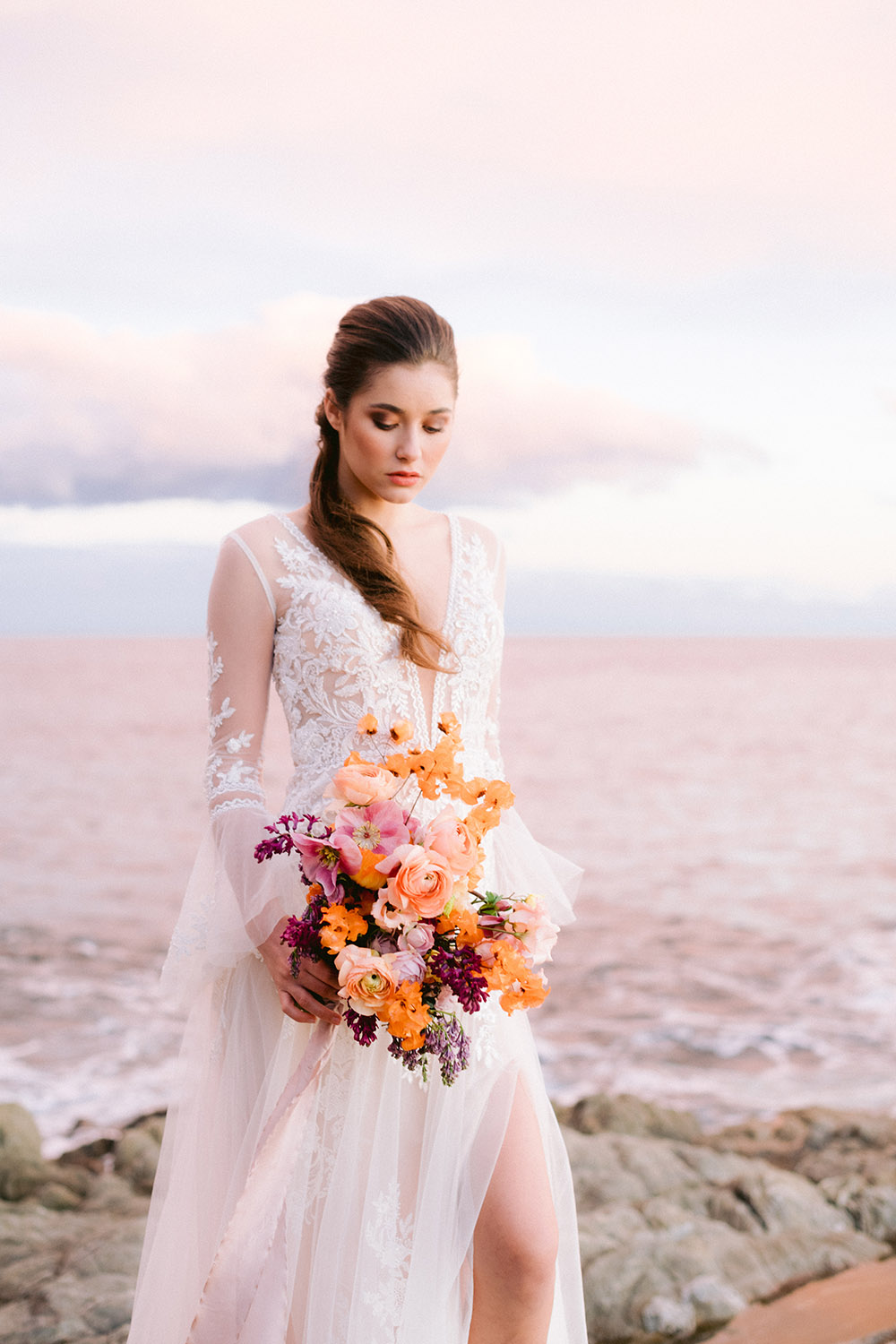 bride with wedding bouquet at the beach